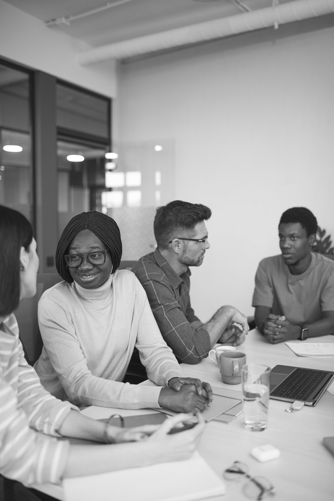 People Talking While Sitting at Office Desk